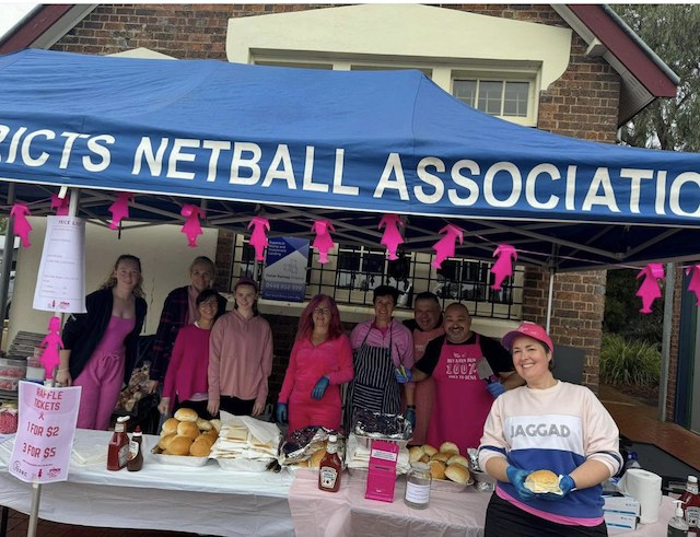 Volunteers at the netball club’s pink-themed fundraising barbecue